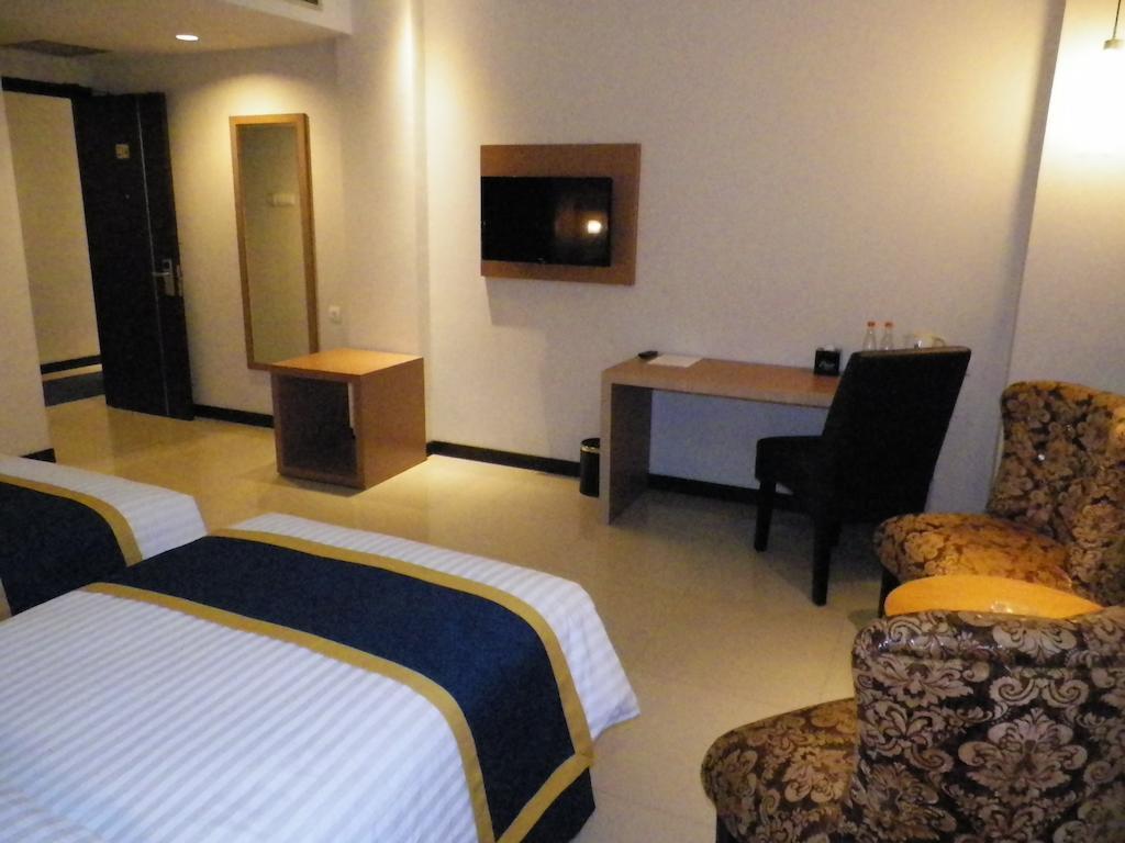 D'Best Hotel Pasar Baru Bandung Szoba fotó